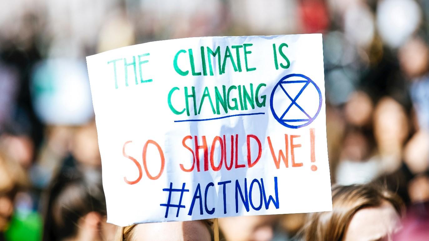 Picture with protest sign about climate change